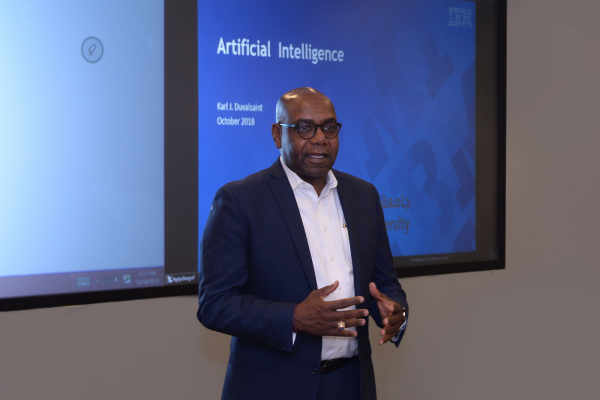 Group of seniors and junior managers on meeting room.